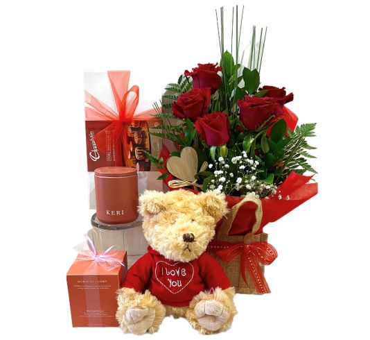 flowers with teddy bear and chocolates